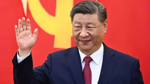 Getty Images Chinese President Xi Jinping waves during a meeting with Vietnam's communist party general secretary To Lam at the Office of the Party Central Committee in Hanoi on 14 April 2025.