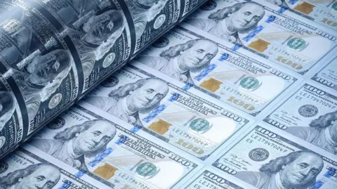 Getty Images 100 dollar bills being printed
