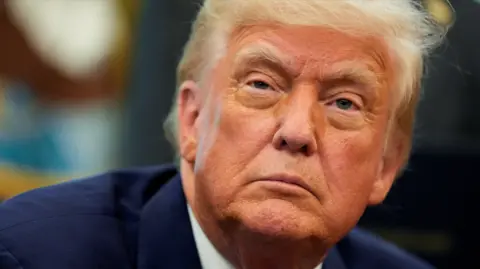 Reuters A picture of Donald Trump showing his face close up. He is wearing a blue suit
