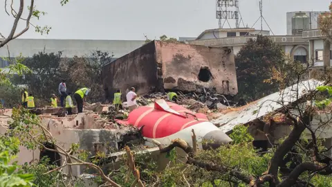 AFP via Getty Images A picture of the crash site of the Air India plane