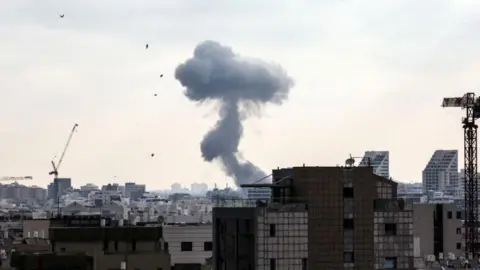 Reuters Smoke can be seen as during a missile attack from Iran on Israel, amid the Iran-Israel conflict, in Tel Aviv, Israel, June 22, 2025.