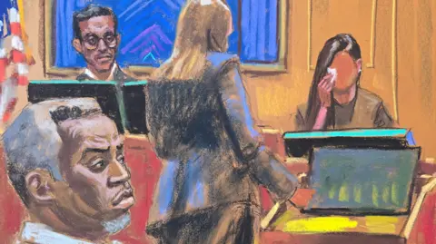 Jane Rosenberg/Reuters In a courtroom sketch, Sean "Diddy" Combs watches as a prosecutor questions "Jane" during Combs' sex trafficking trial in New York City.