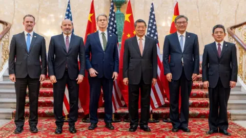 Getty Images US Treasury Secretary Scott Bessent and Chinese vice premier He Lifeng pose for a photo with US Trade Representative Jamieson Greer, U.S. Secretary of Commerce Howard Lutnick, Chinese Commerce Minister Wang Wentao, and China's International Trade Representative and Vice Minister of Commerce Li Chenggang, in London on 9 June, 2025.