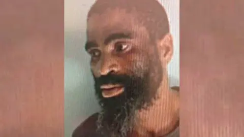South Africa police A mugshot of James Neo Tshoaeli, nicknamed Tiger, that was released by police