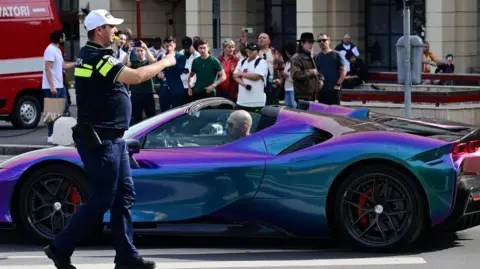 Getty Images British-American influencer Andrew Tate drives a sports car in Bucharest, 27 April 27