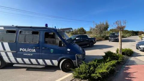 BBC News Investigators arriving at the police checkpoint in an area between the cities of Lagos and Praia da Luz to begin the third day of their search