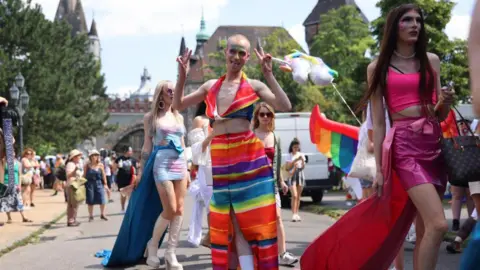 Getty Images A street in Budapest is filled with people dressed in colourful clothing celebrating Pride in 2023