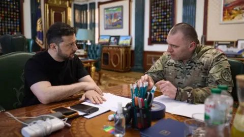 Ukraine Presidential Press Service/EPA-EFE/Shutterstock Ukrainian President Volodymyr Zelensky speaks with the Head of the Security Service (SSU) Vasyl Maliuk, who was reporting on the operation against Russian airbases