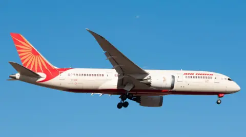 Reuters FILE PHOTO: The Air India Boeing 787 Dreamliner plane that crashed in Ahmedabad on June 12, 2025, flies over Melbourne, Australia, on December 29, 2024, in this handout picture. RYAN ZHANG/via REUTERS/File Photo