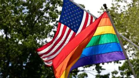 Getty Images US and Pride flags fly side-by-side in a stock image