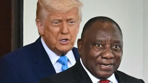 Getty Images Donald Trump is behind Cyril Ramaphosa as he welcomes him to the White House in Washington, DC, on 21 May 2025