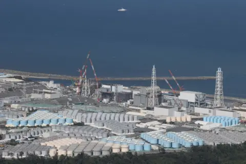 Getty Images This aerial picture shows storage tanks used for storing treated water at TEPCO's crippled Fukushima Daiichi Nuclear Power Plant