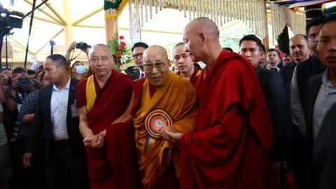Reuters Tibetan spiritual leader, the 14th Dalai Lama, arrives to attend his 90th birthday celebration at the Tsuglagkhang