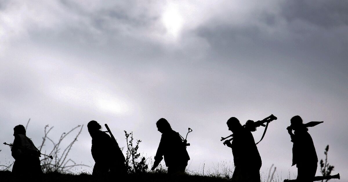 Kurdish PKK fighters destroy weapons at key ceremony