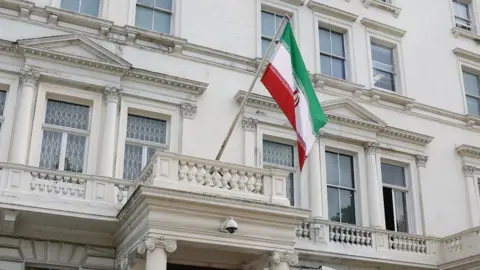 Reuters A flag flies in front of Iran's embassy, in London