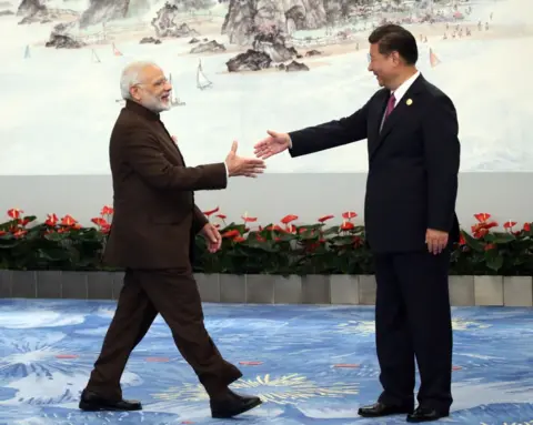 Getty Images Indian Prime Minister Narendra Modi (L) shakes hands with Chinese President Xi Jinping (R) prior to the dinner on September 4, 2017