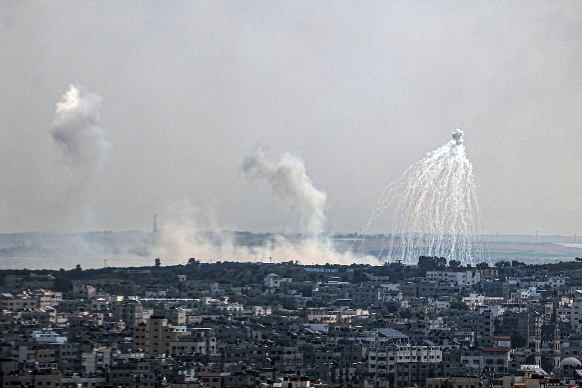 Smoke rises as the Palestinian Foreign Ministry claimed that Israel used phosphorus bombs in its attacks on populated areas in Gaza City, Gaza on October 11, 2023. [Photo by Ali Jadallah/Anadolu via Getty Images]