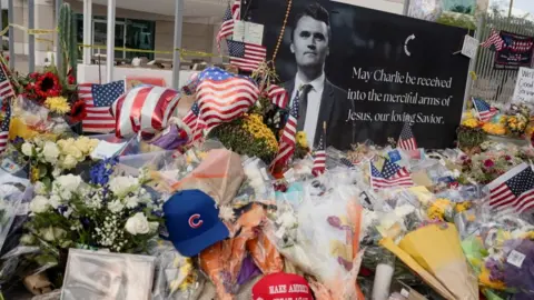 Reuters A memorial for Charlie Kirk outside Turning Point USA's headquarters in Arizona.