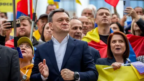 EPA Prime Minister of Moldova Dorin Recean (C) attend a march to support the voting process at parliamentary elections in front of Parliament of Moldova in Chisinau