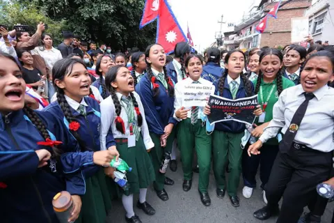 Getty Images Protesters clash with police outside parliament in Kathmandu, Nepal, on September 8, 2025, as thousands of youths rally against the government's social media ban and widespread corruption.