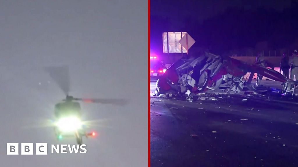 Moment helicopter crashes onto California interstate