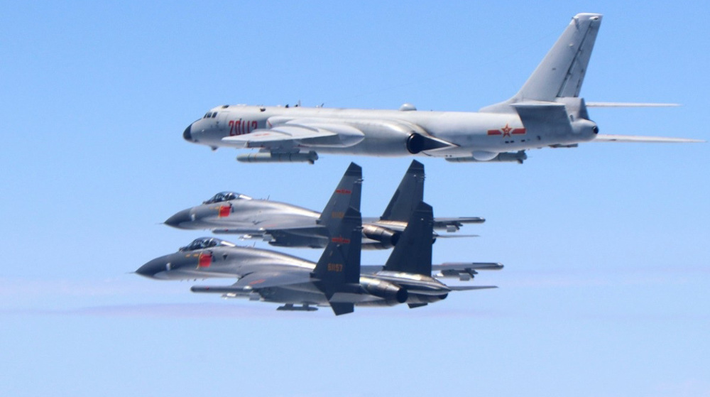 China says bombers, fighter jets flew near Taiwan ahead of Trump-Xi meeting