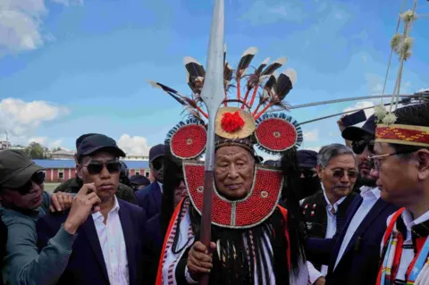 AP National Socialist Council of Nagaland (Isak-Muivah) leader Thuingaleng Muivah being welcomed on his return to his native village of Somdal after fifty years, in Ukhrul on Wednesday