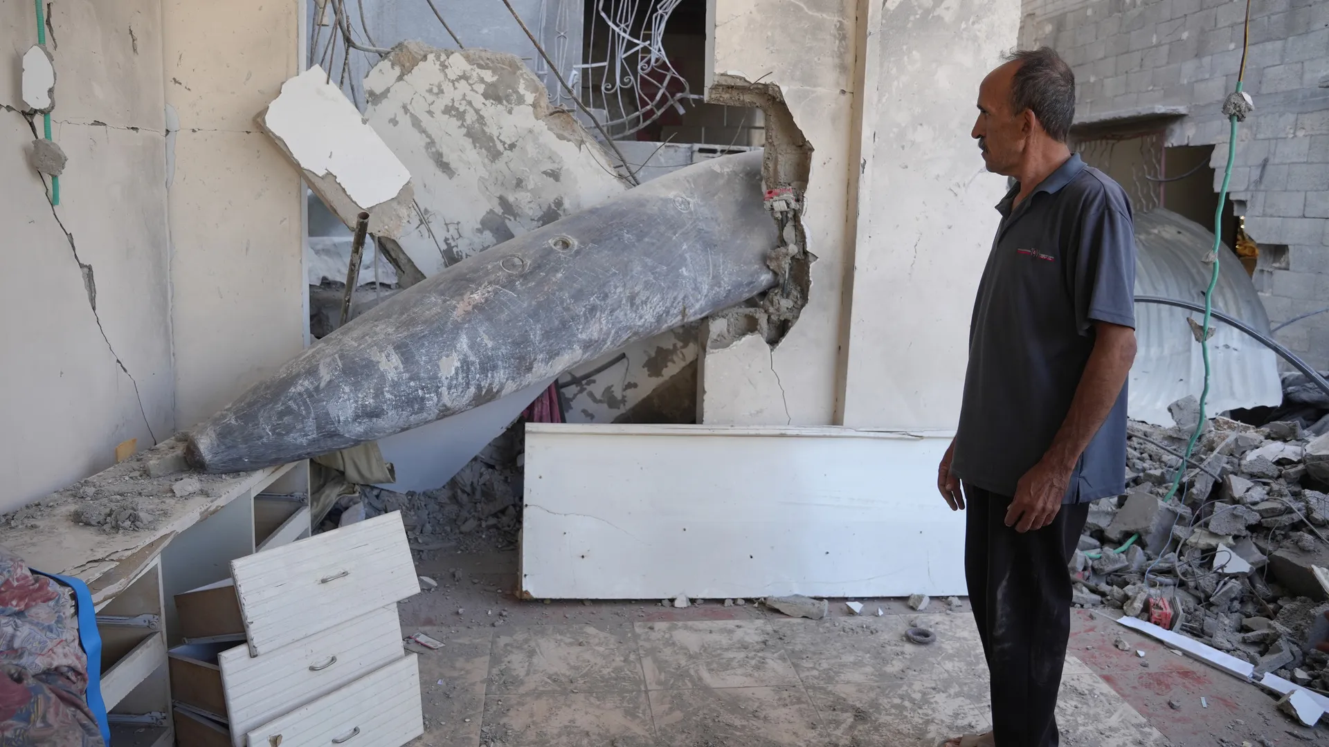Gaza family forced to live around undetonated bomb lodged in their home | Gaza