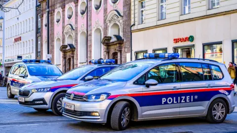 Getty Images Police cars in Innsbruck, western Austria