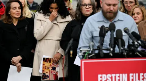 Reuters Survivors Lisa Phillips, Jess Michaels, and Annie Farmer look sad as as Sky Roberts, brother of late sex offender Jeffrey Epstein's late victim Virginia Giuffre, speaks during a press conference