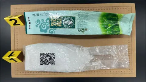 Jeju Coast Guard The wrapper of a Chinese oolong tea bag laid along side a pack of ketamine