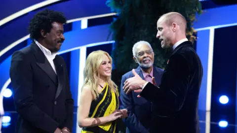 PA Media Prince William is joined on stage by Kylie Minogue, Seu Jorge and Gilberto Gil 