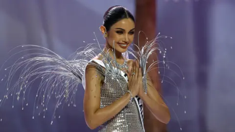 EPA A Thai beauty queen with hands clasped in prayer