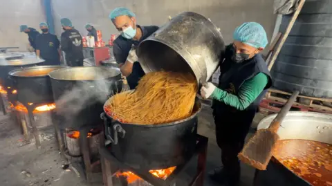 BBC Forty cooks prepare food at the Anera community kitchen in al-Zuwayda, central Gaza