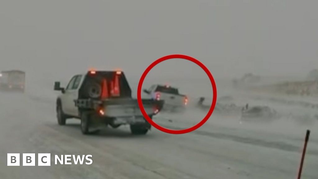 Car nearly hits first responders in Midwest blizzard conditions