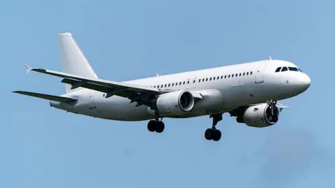 Getty Images Airbus A320-214 of FlyOne against a blue sky