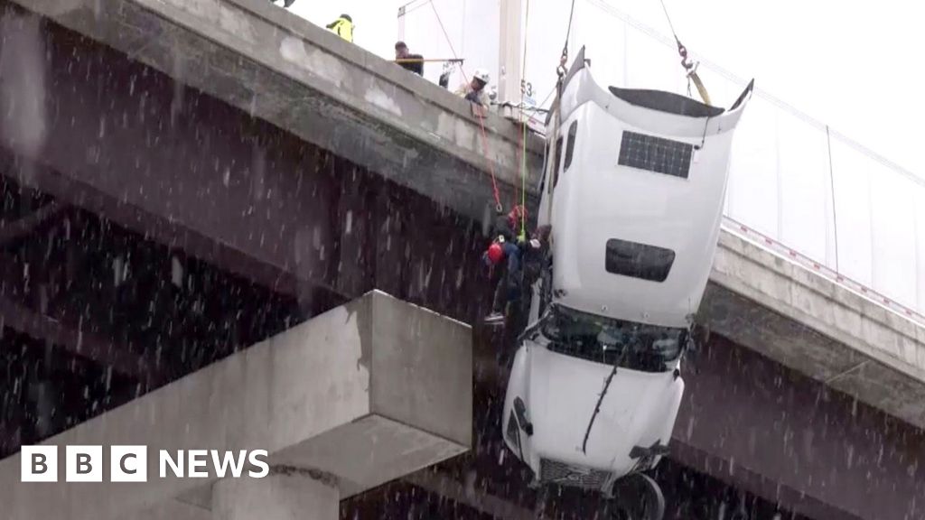 Driver rescued from truck dangling off a West Virginia bridge