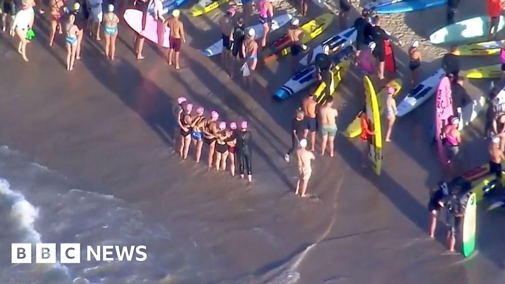 Surfers and swimmers pay tribute to victims of Bondi shooting