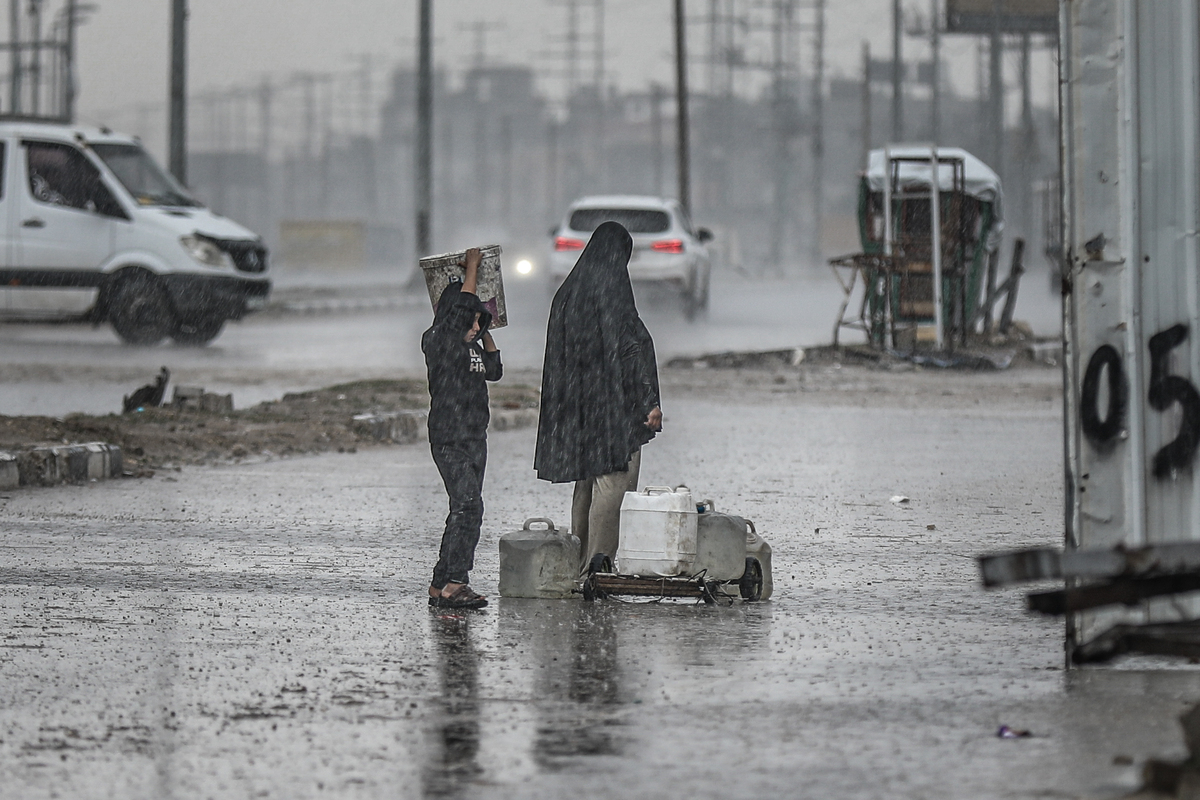 Palestinians struggle to survive under harsh weather conditions at makeshift tents as heavy rainfall and strong winds damage the shelters amid Israeli attacks at the Bureij Refugee camp in Gaza City, Gaza on December 27, 2025. [Adem Bilal - Anadolu Agency]