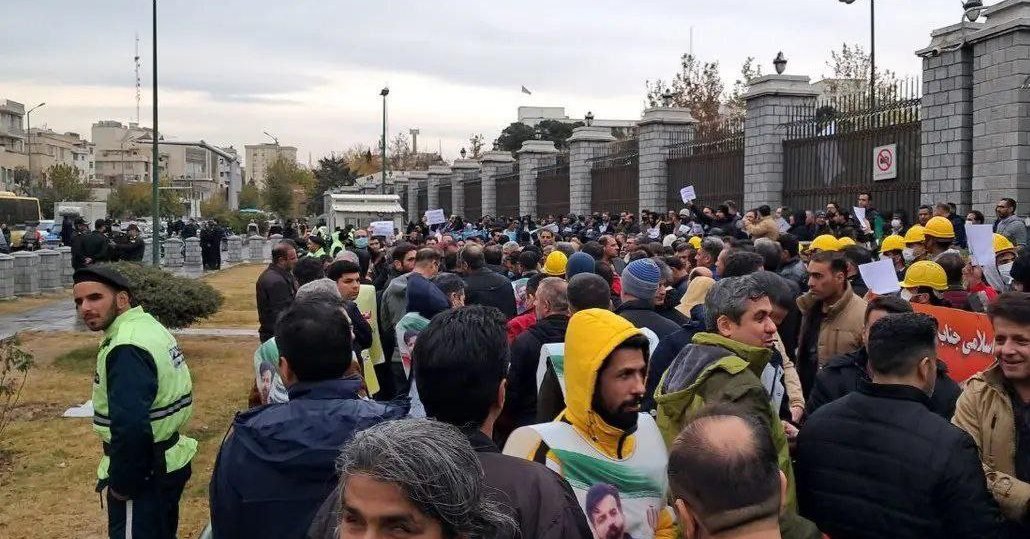 Iran welfare staff, contract workers protest outside parliament