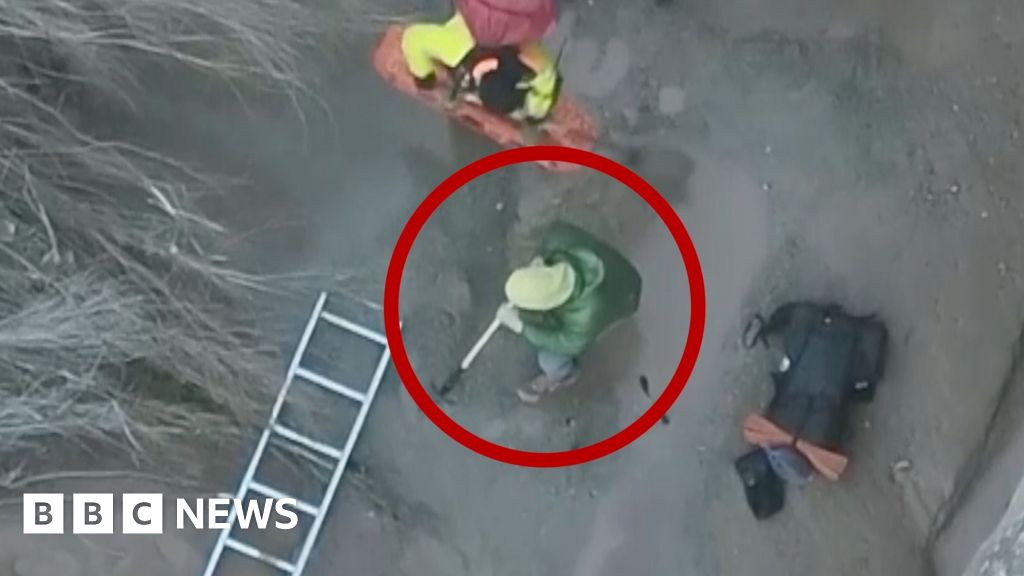 The hiker said he thought the ground was solid before his leg sank into the muck, trapping him until a rescue team arrived