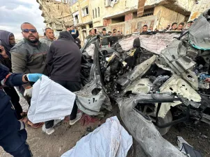 A violation of the ceasefire and the bombing of a vehicle carrying a senior leader in the Al-Qassam Brigades in Gaza, on 13 December 2025. [Mohammed Asad/Middle East Monitor]