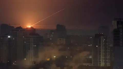 Reuters A missile is shot down over residential buildings in Kyiv