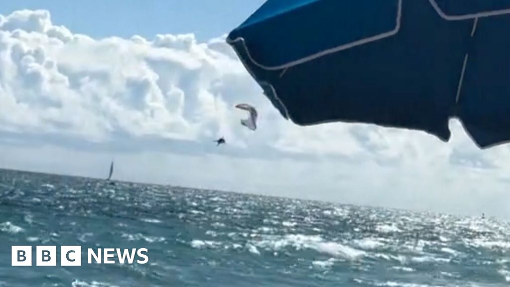 Paraglider survives 500ft drop into ocean