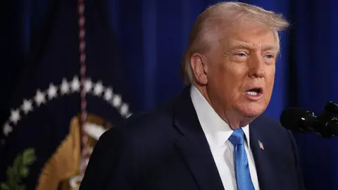 Getty Images President Donald Trump confirms a US military operation in Venezuela during a press conference on 3 January