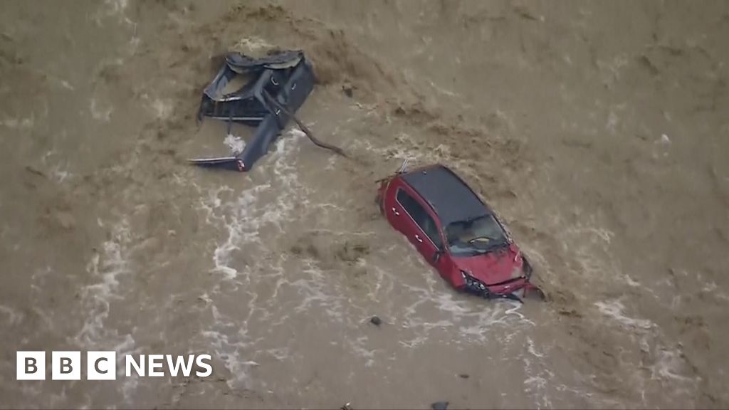 Aerial footage shows cars swept by flash floods in Australia
