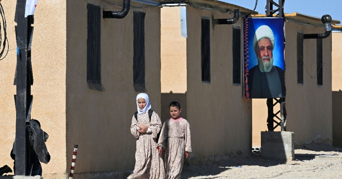 In Lebanon, a Hezbollah-run camp houses people escaping Syria