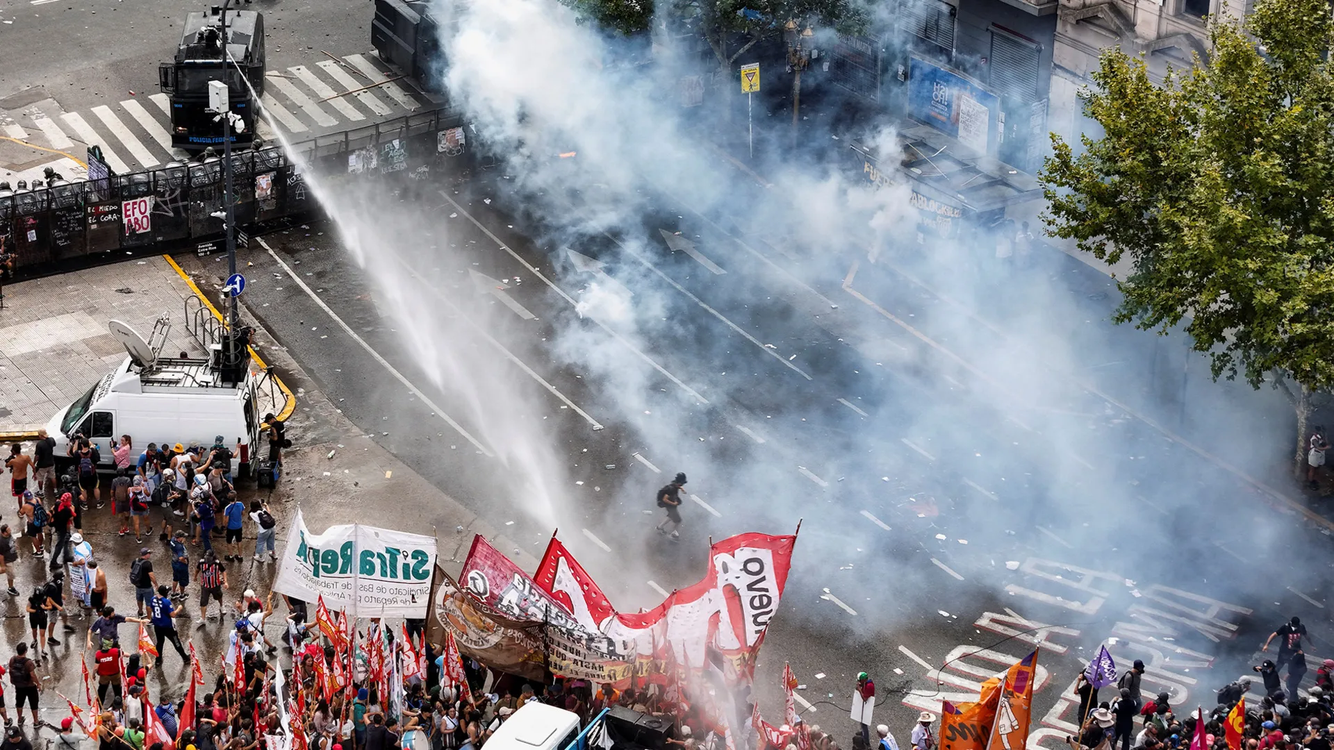Argentinian security forces fire water cannon and tear gas at protesters | Police