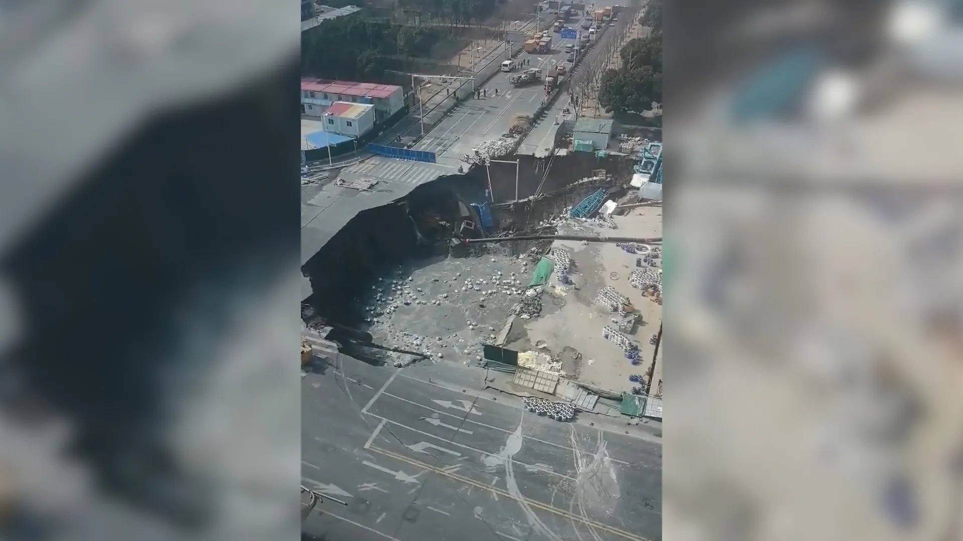 CCTV video captures moment sinkhole swallows road in Shanghai | Infrastructure