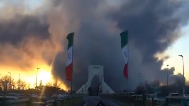 Tehran’s Landmark Azadi Tower Seen Surrounded By Smoke And Flames